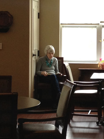 My Mom was a big reader. Here she is "reading" a book in the dementia care unit.