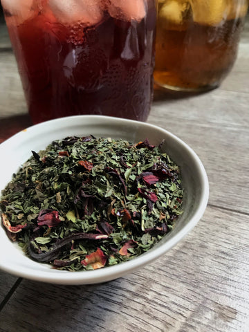 Shanti Chai & Co's Happy Hibiscus Blend, an herbal blend of peppermint leaf, hibiscus flowers and rose hips. Delightful served hot or iced. 