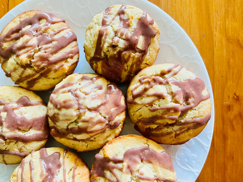 lemon muffins with elderberry glaze on a plate