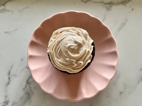 chocolate cupcake with elderberry cream cheese frosting