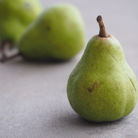 Pears sitting on a counter