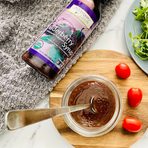 elderberry vinaigrette next to elderberry syrup bottle