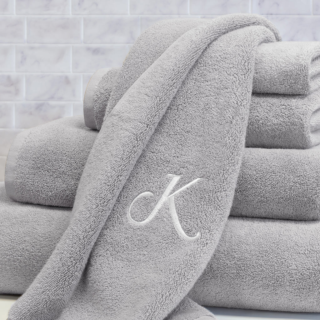 grey and white bath towels