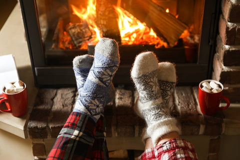 feet warming by the fire