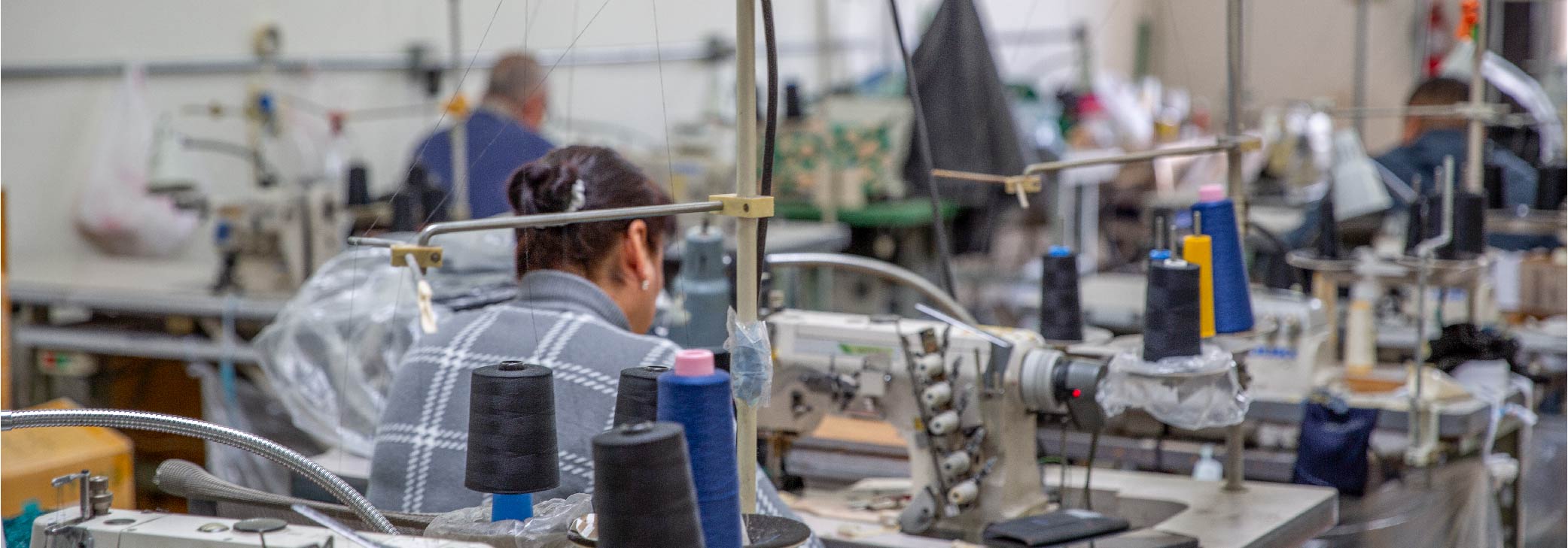 people sewing swimsuits at Bellas Fashion