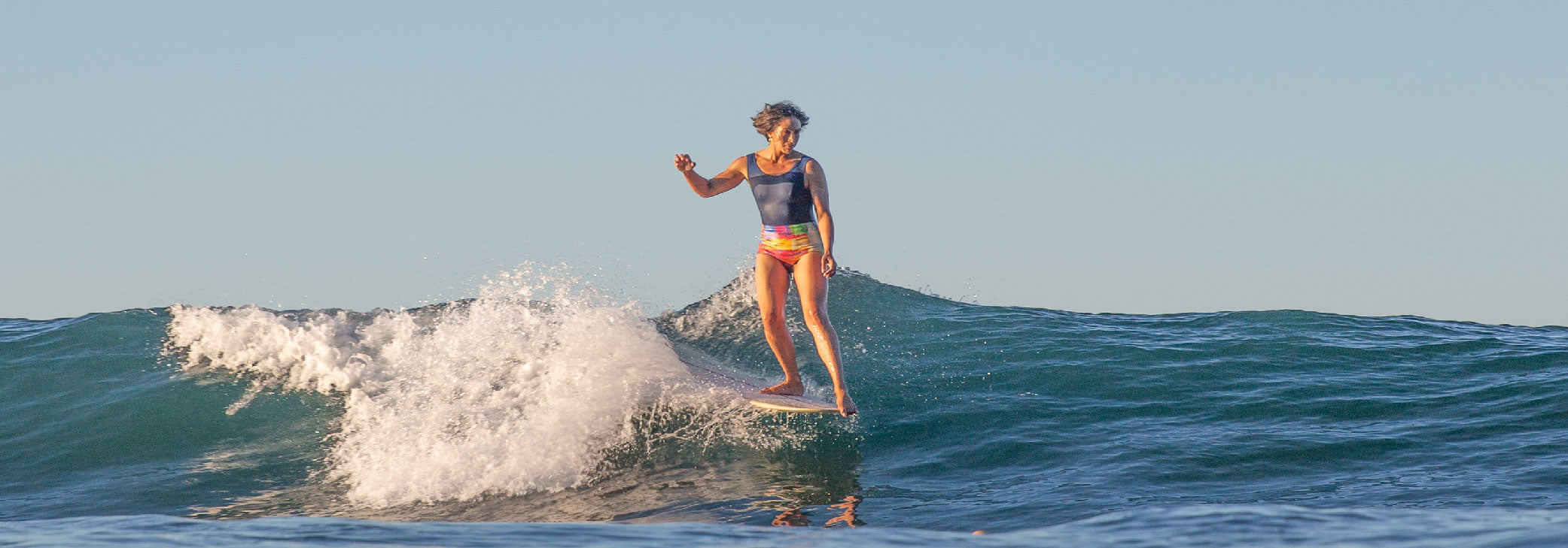 surf longboard women Mexico surf trip one piece swimsuit colorful blue