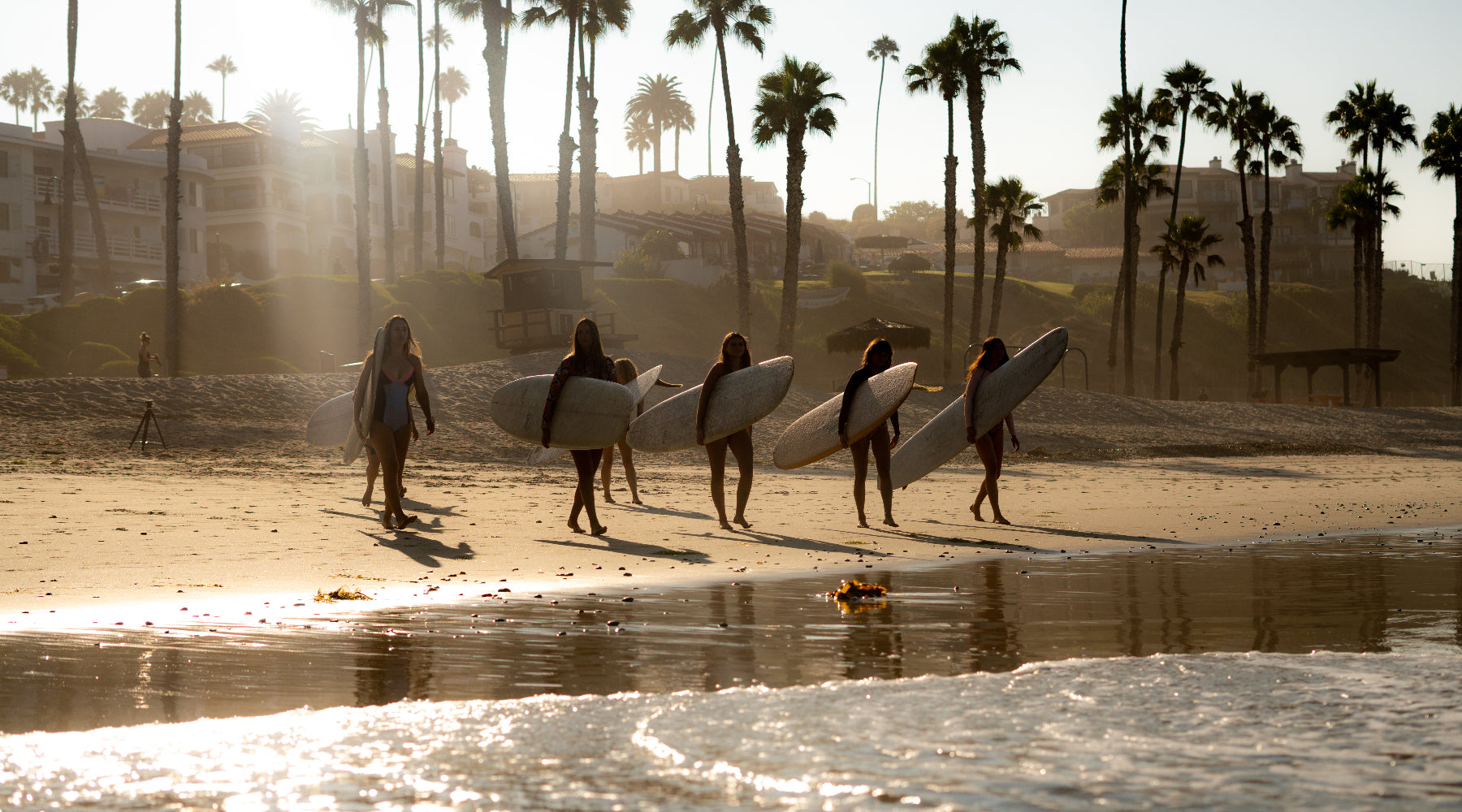 women surfing together