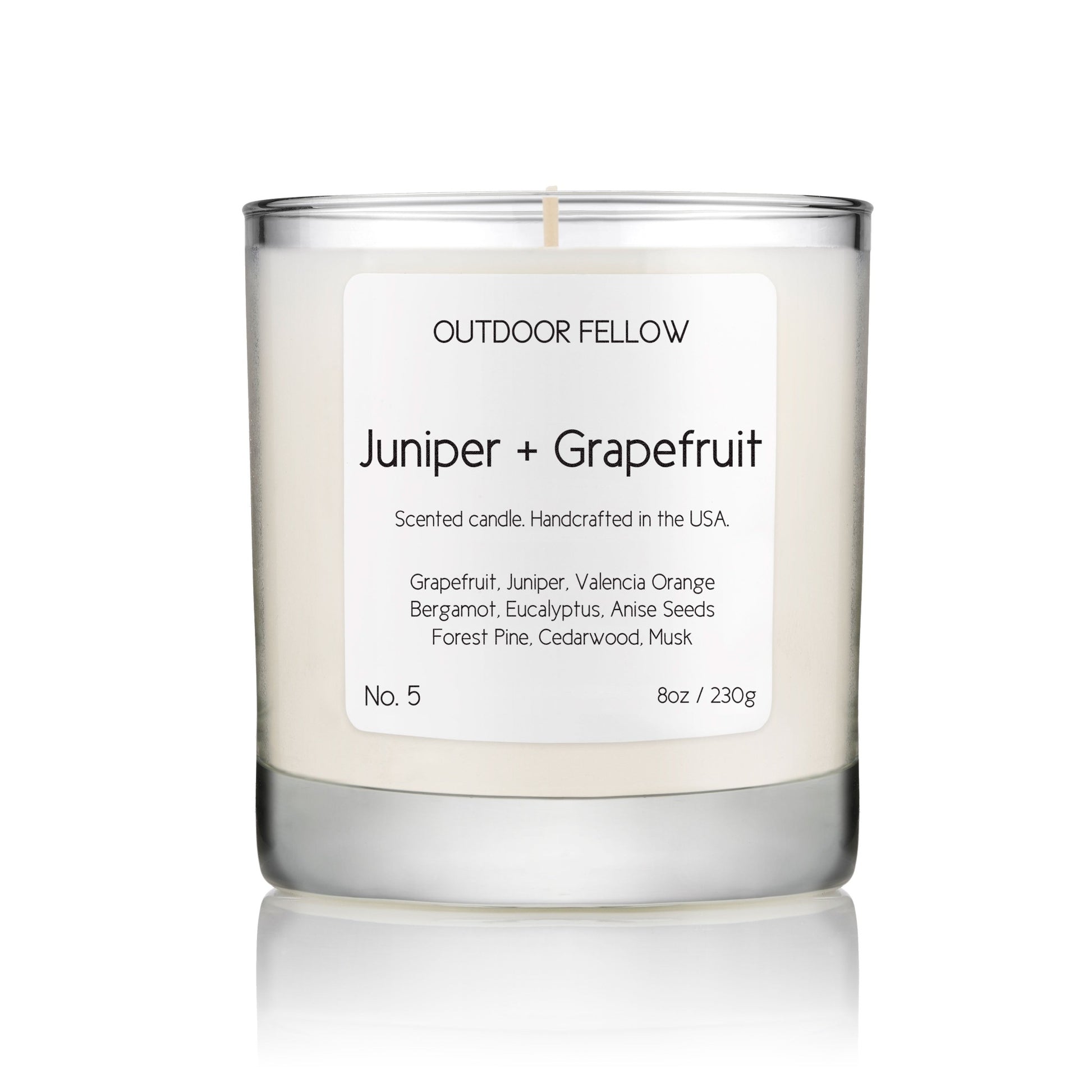 Juniper and Grapefruit scented candle on white background