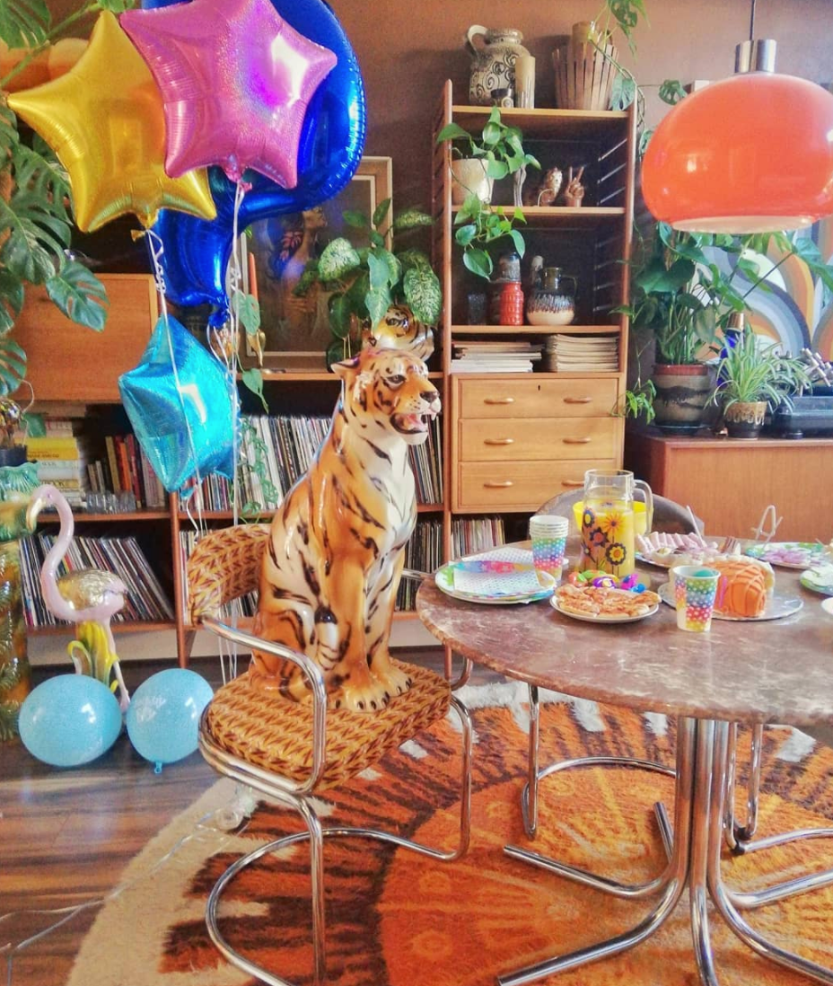 vintage ceramic tiger statue attends a tea party in a balloon filled room!