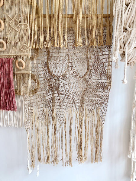 a female body made from jute and macrame knots