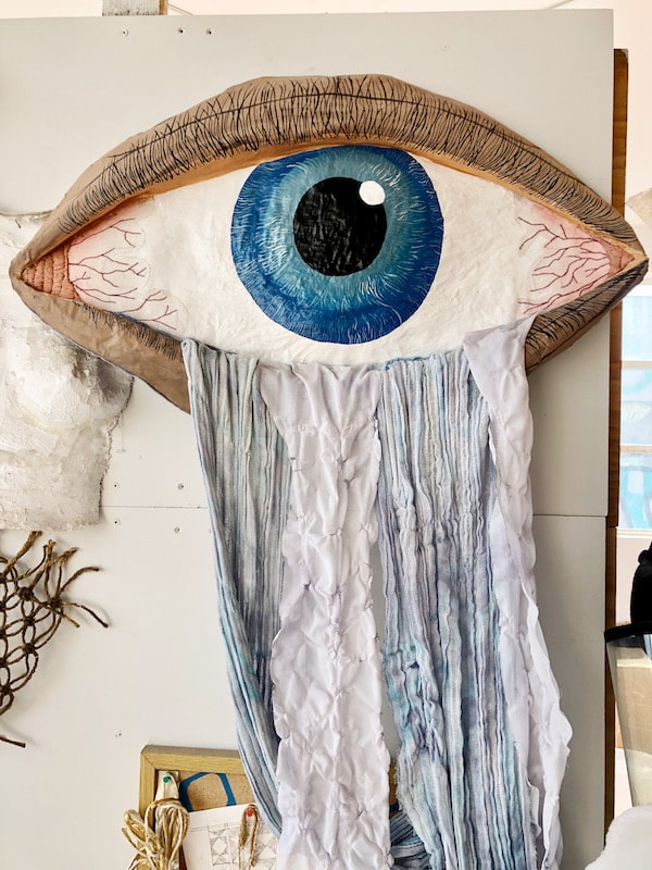 A teary eye, fiberart made from embroidery and dyed silk by Daniela Chiñas