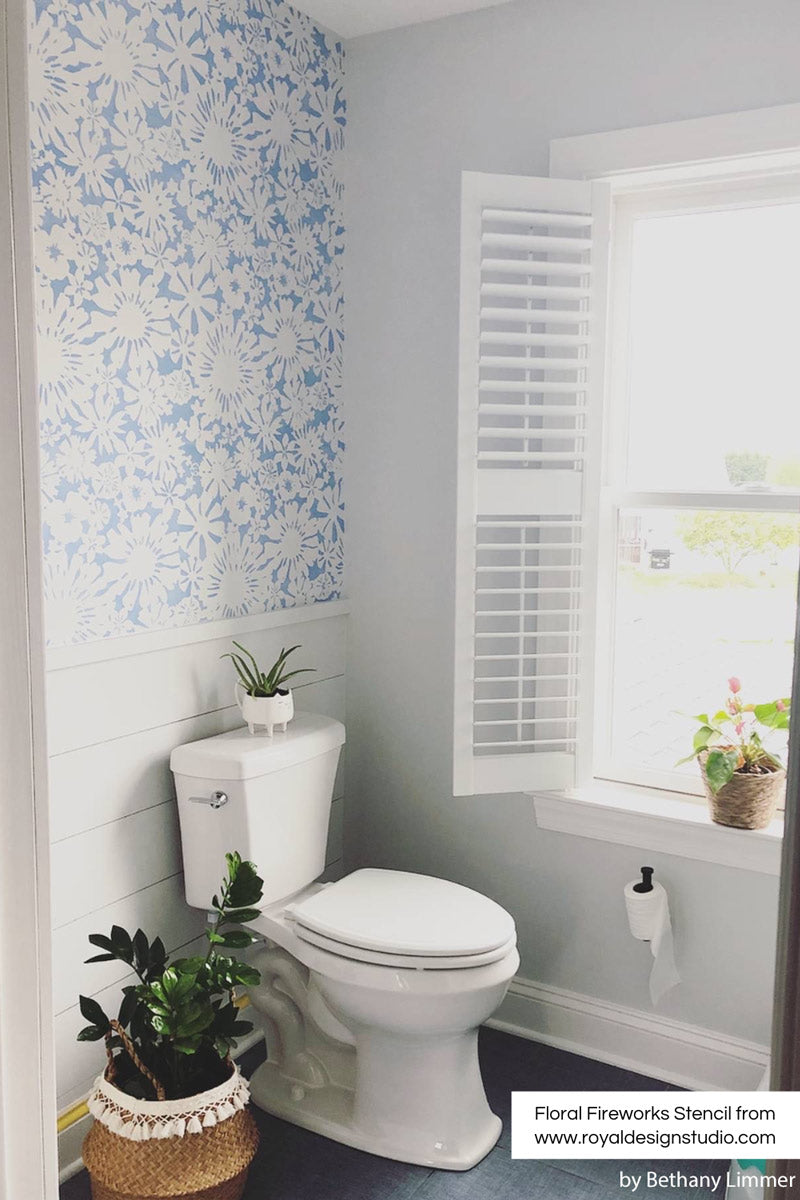 Blue paint with floral wall stencil in bathroom