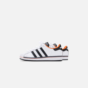 orange and white adidas superstar