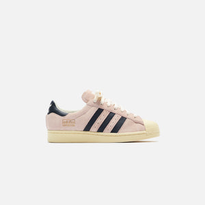 white adidas with pink