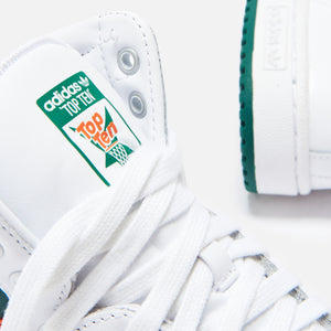 green and white high top adidas