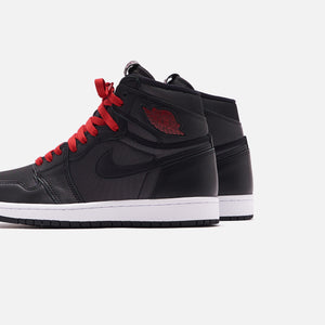 black and red jordans grade school