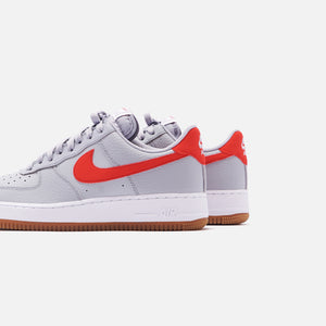 grey and red nike air force 1