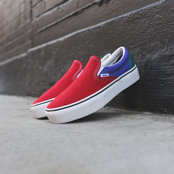 red and blue slip on vans