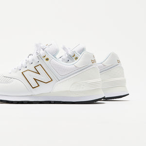 white and gold new balance