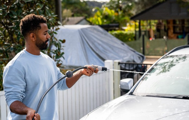 blaster nozzle being used to clean car