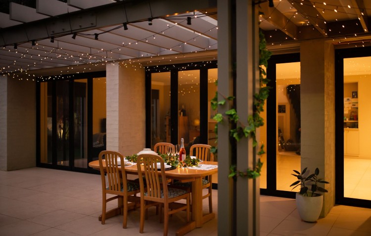 outdoor dining set up with fairy lights