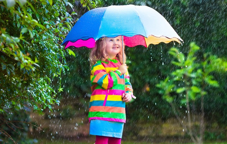 Girl in the garden while it's raining