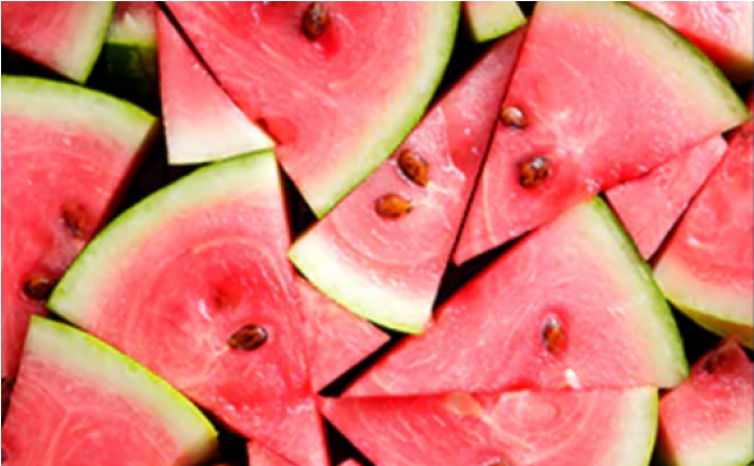 Sliced watermelon with seeds on display.