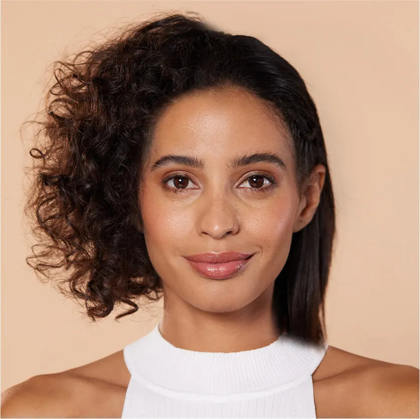 Fast straightening with TYMO hair styling tool, transforming curly hair to sleek straight hair in half the time.