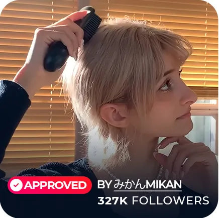 KOL Mikan, with 327K followers, styling her hair using a TYMO PORTA cordless hair straightener at home.