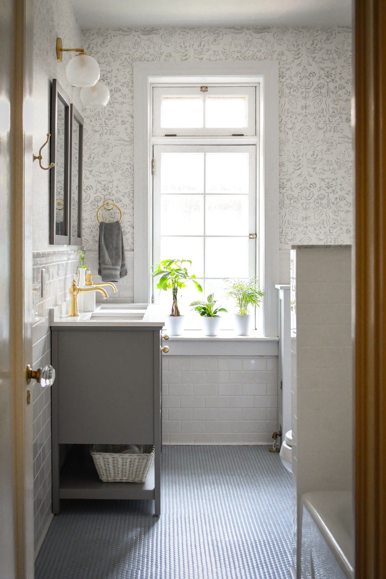 Storyline (White) Wallpaper in a bathroom | Design by Copper and Cotton | Hygge & West