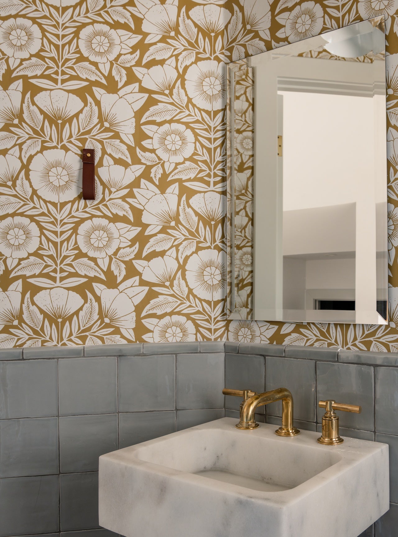 Conservatory (Ochre) Wallpaper in a bathroom designed by Sarah Malek Barney