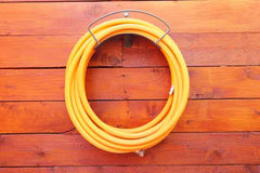 Wall mounted hose hanger