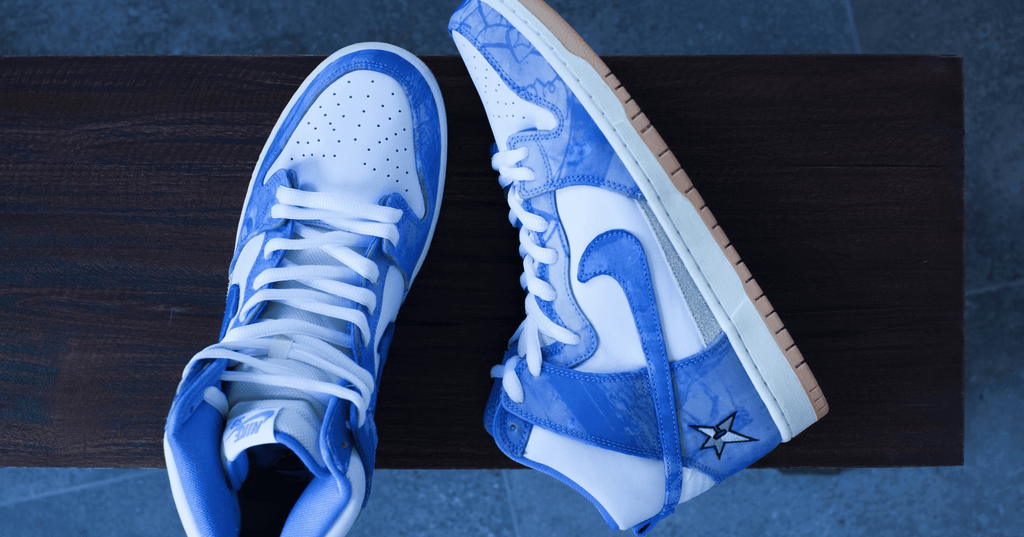 a pair of Nike Dunk High on a shoe box