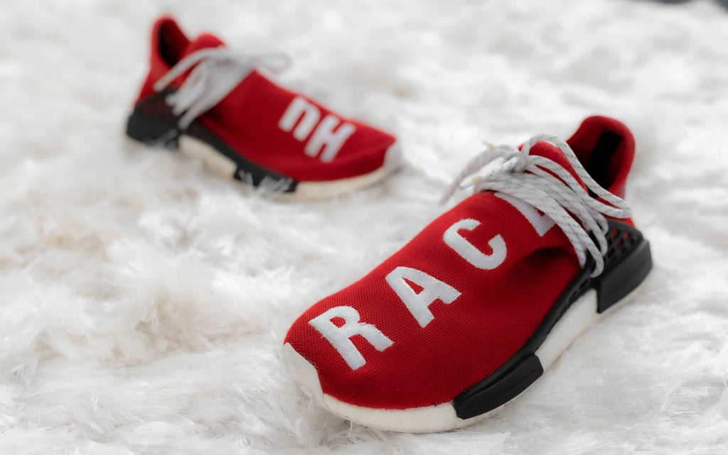 White and red sneakers on white background