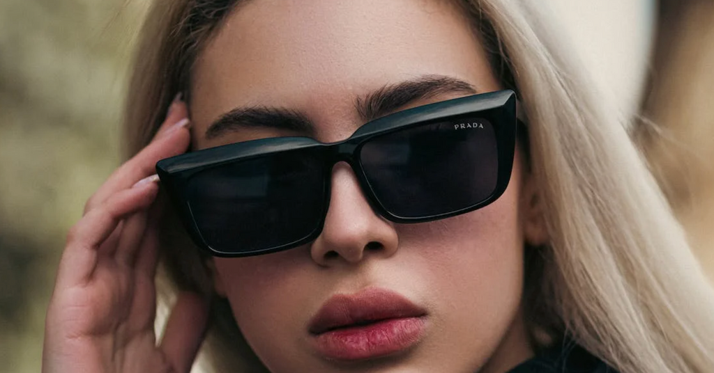 woman wearing Prada sunglasses