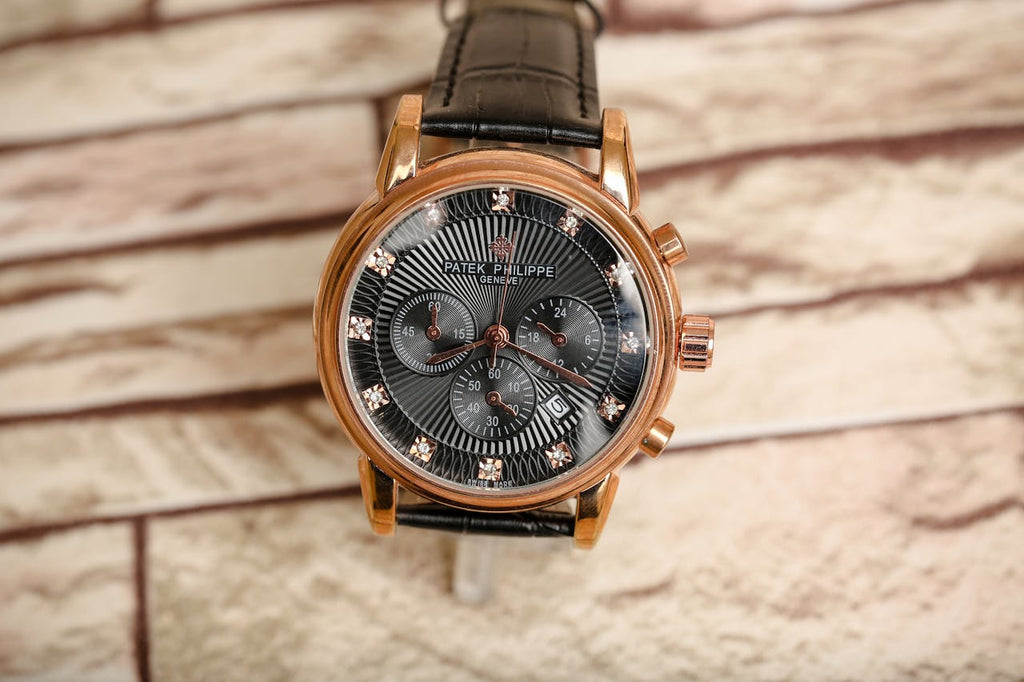 a black and brown patek philippe watch