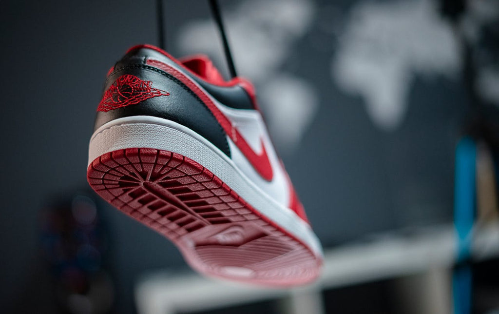 a red and black jordan sneakers