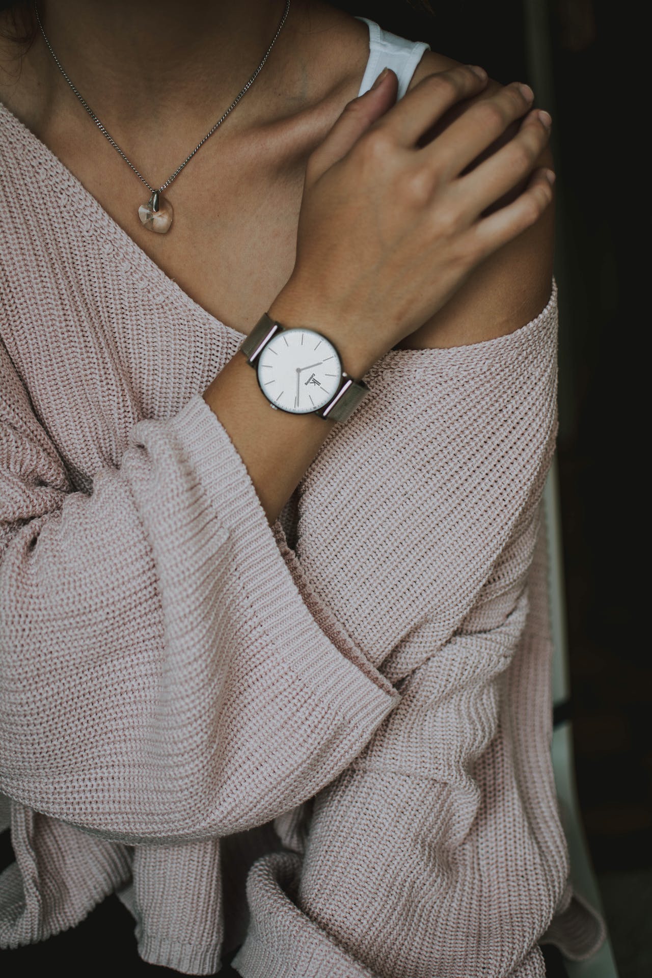 a person with a watch on her hand