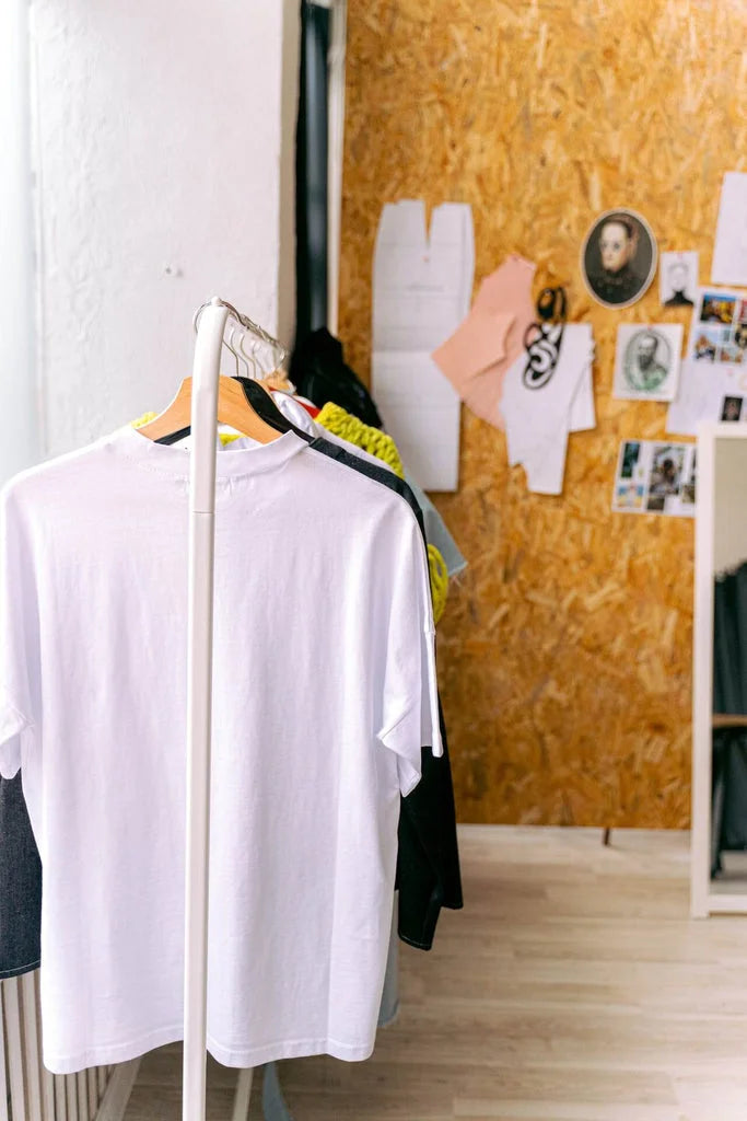 a rack with designer clothes