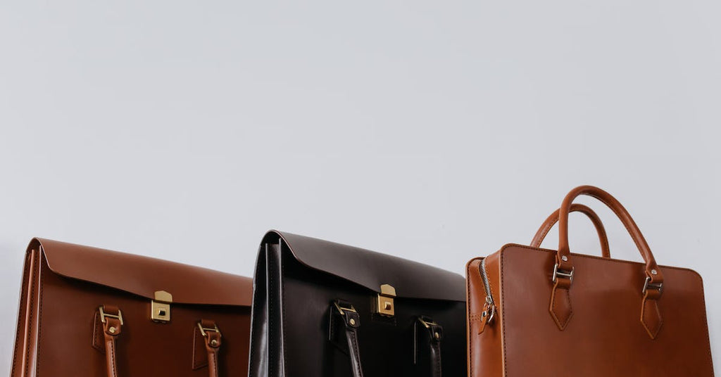 three designer purses lined up