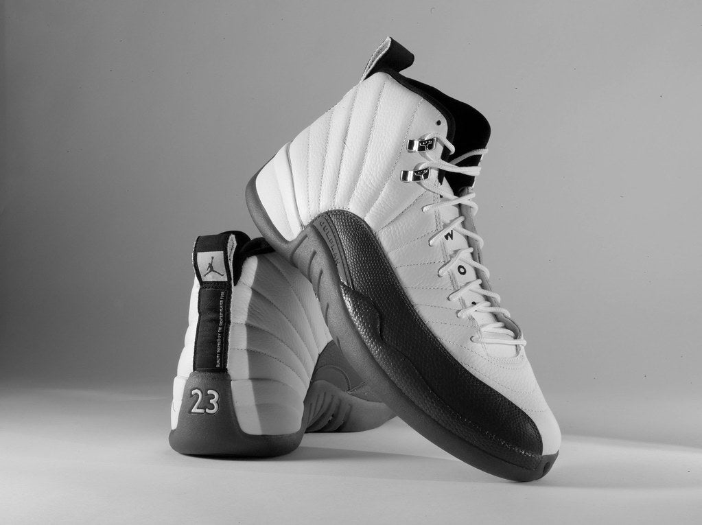 a pair of Jordan 12 sneakers