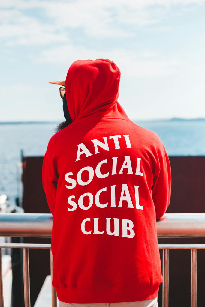 the back of a red anti social club hoodie
