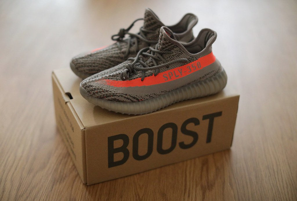 a pair of Yeezys v2 Beluga on a shoe box