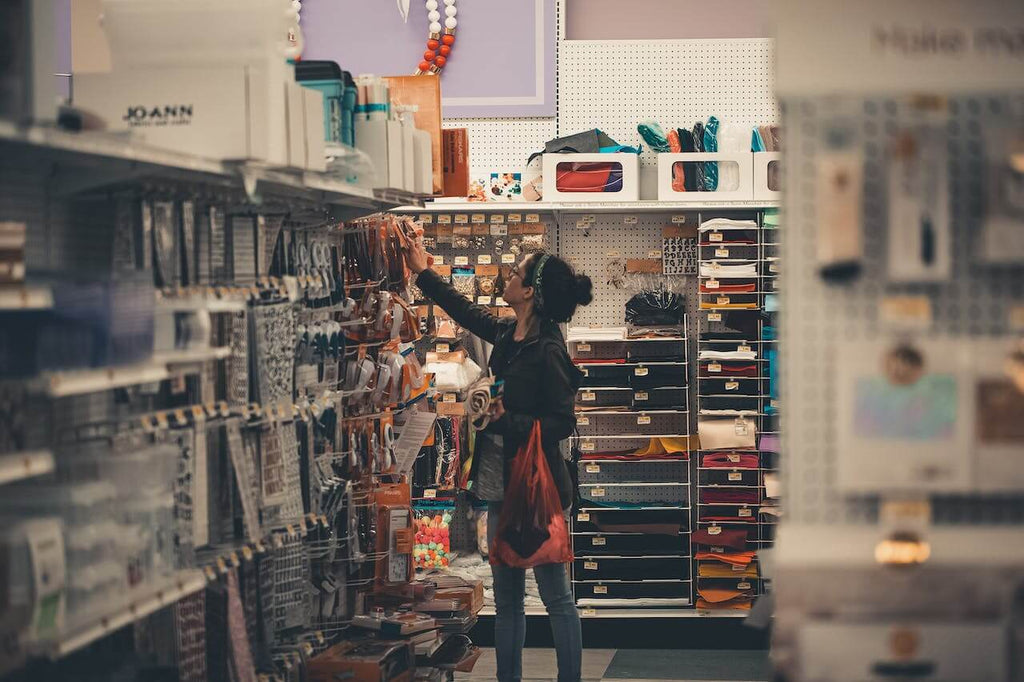 a woman shopping at a consignment store