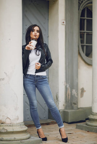 girl standing and enjoying her coffee