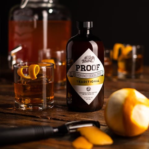 a big batch of Old Fashioneds sits in a pitcher, awaiting guests at a football party