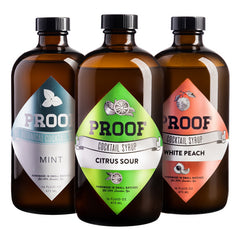 three Proof Syrup bottles: Mint, Citrus Sour, and White Peach