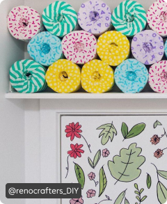 Three rows of toilet paper arranged over a shelf