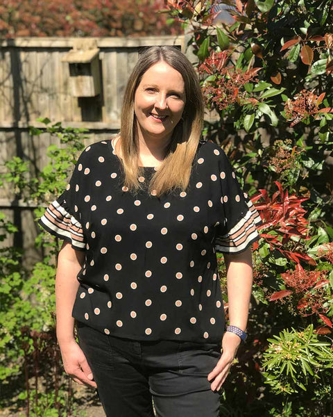 Forget-me-not Lola blouse in black dotted fabric, front view