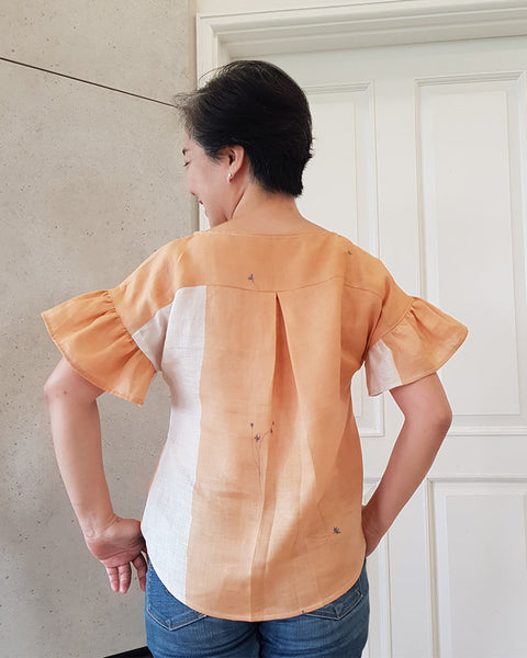 Forget-me-not Lola blouse in apricot linen, back view